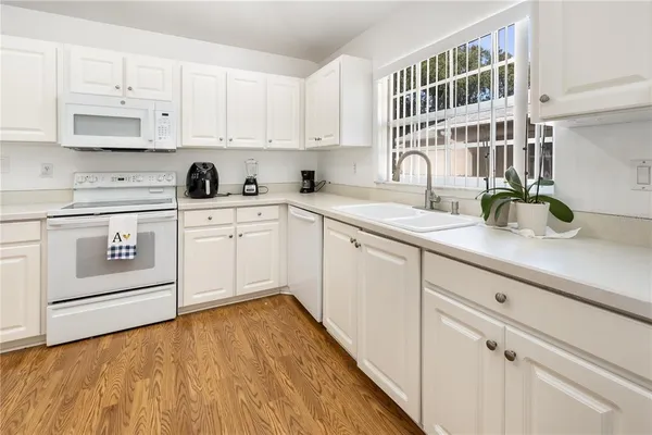 a kitchen with cabinets and appliances