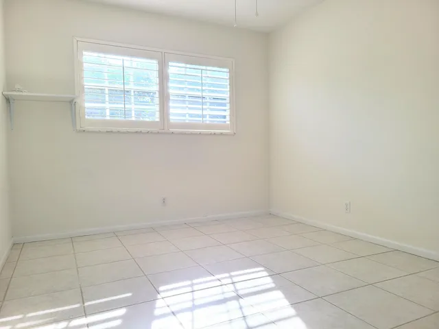 an empty room with white walls