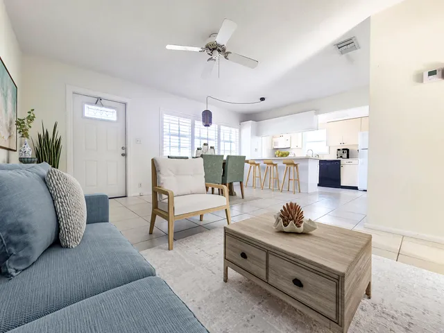 a living room with furniture and a table