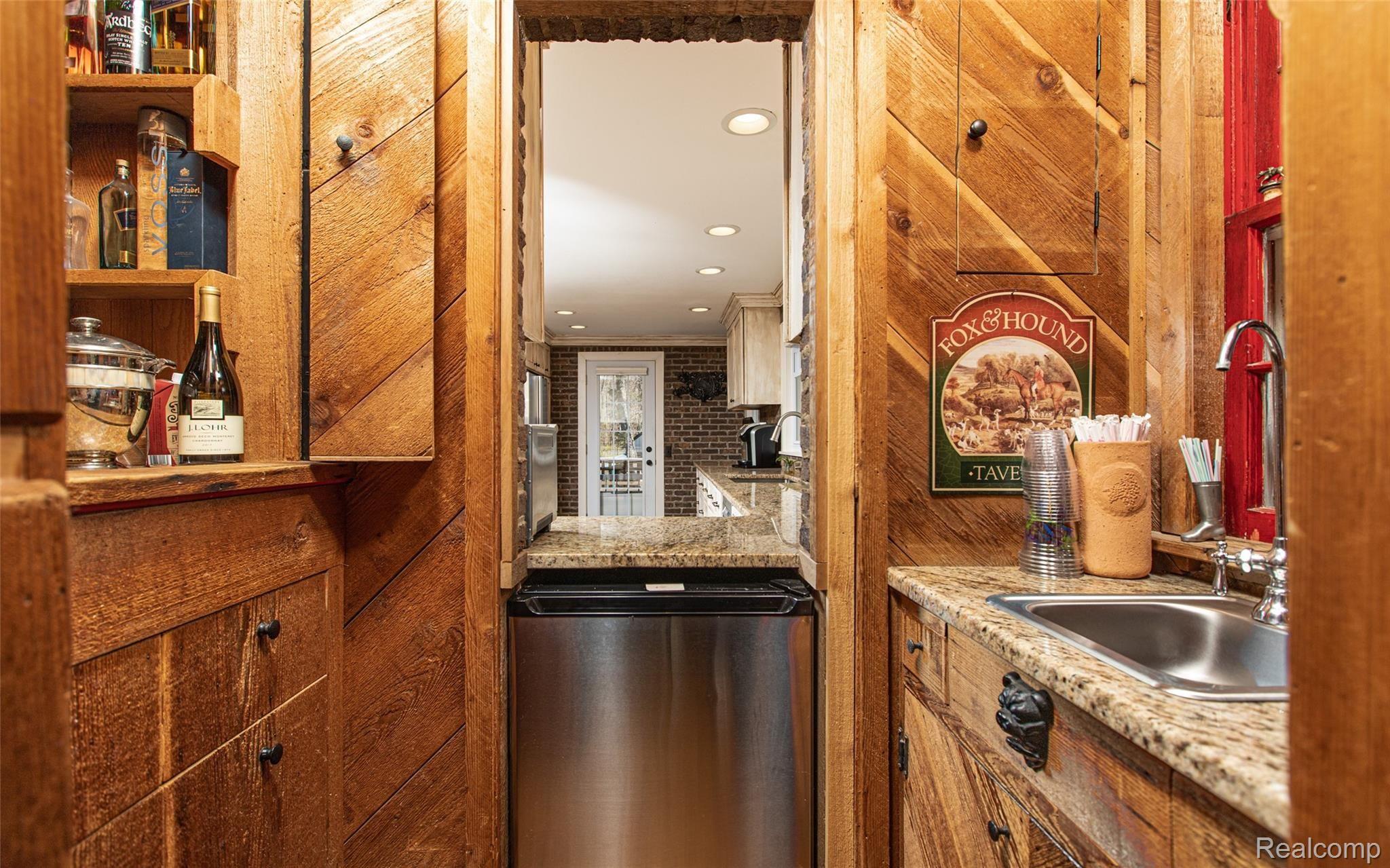 5820 Hempstead Road Metamora, MI 48455 - Photo 15 of 73 15 - Wet Bar with Built in Wine Rack off Great Room.jpg
