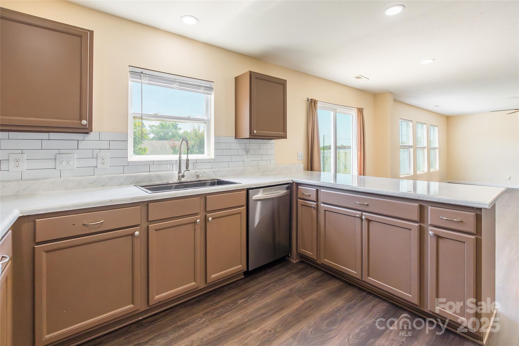 2357 Riding Trail Road Gastonia, NC 28054 - Photo 11 of 32 a kitchen with granite countertop cabinets sink and window