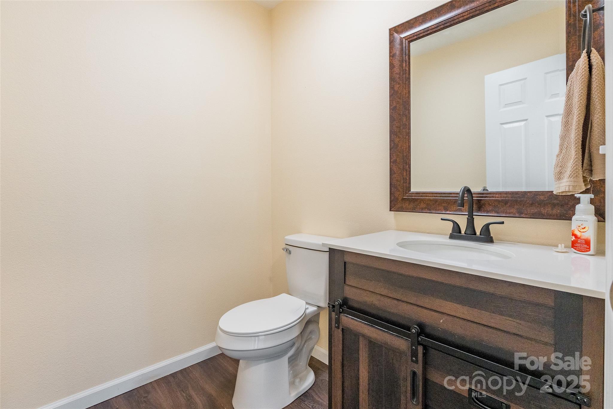 2357 Riding Trail Road Gastonia, NC 28054 - Photo 13 of 32 a bathroom with a sink a toilet and mirror