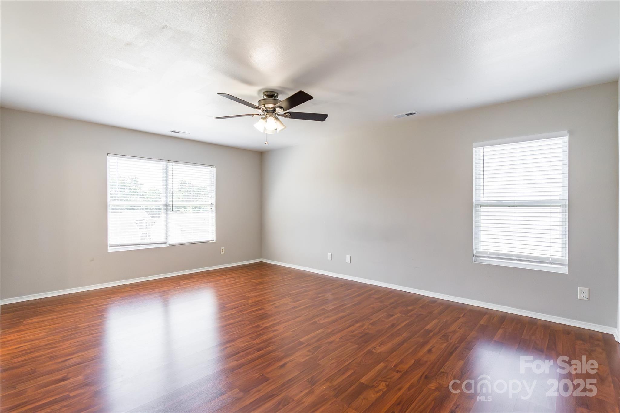 2357 Riding Trail Road Gastonia, NC 28054 - Photo 16 of 32 a view of an empty room with wooden floor and a window