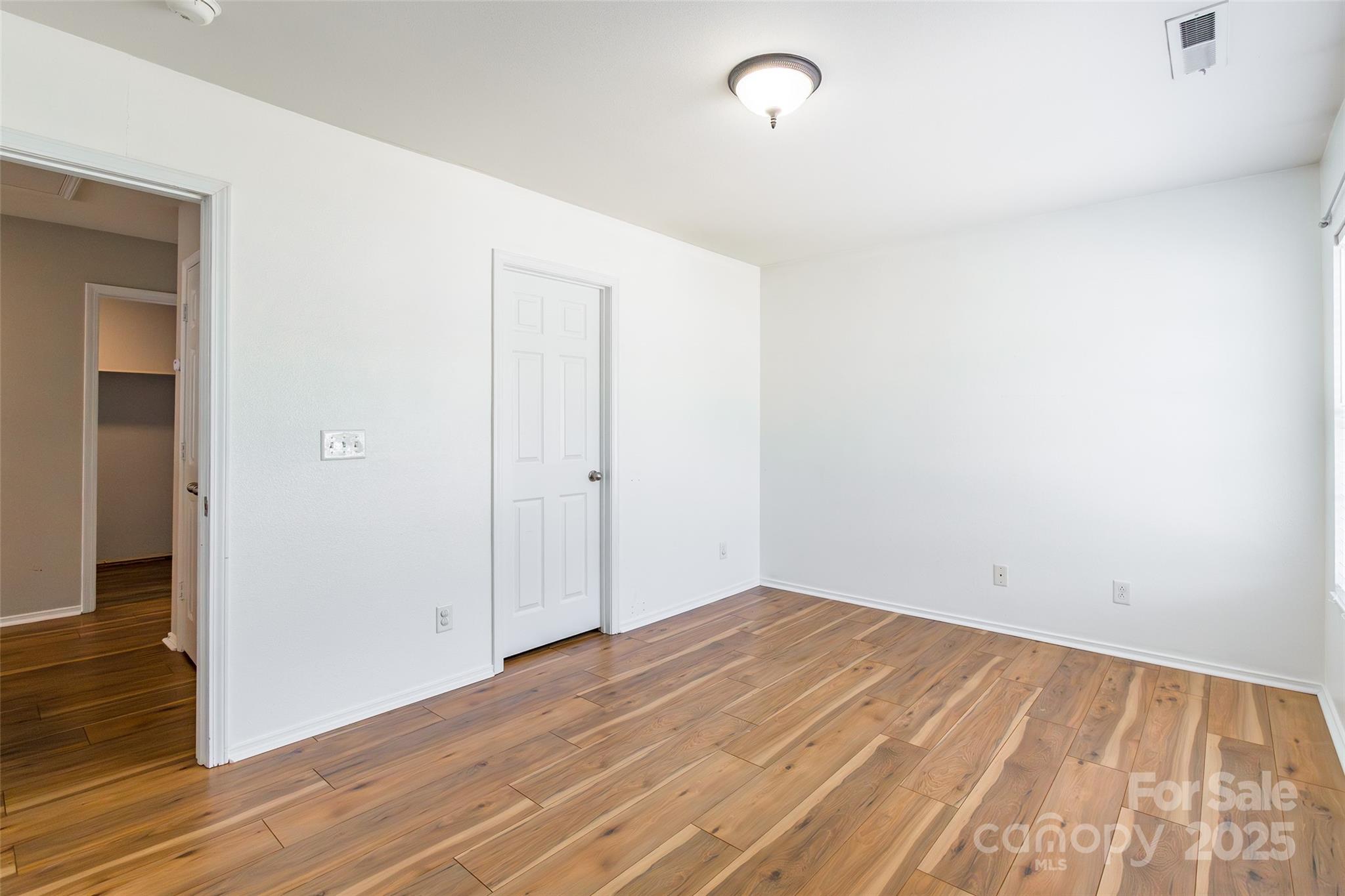 2357 Riding Trail Road Gastonia, NC 28054 - Photo 21 of 32 a view of empty room with wooden floor