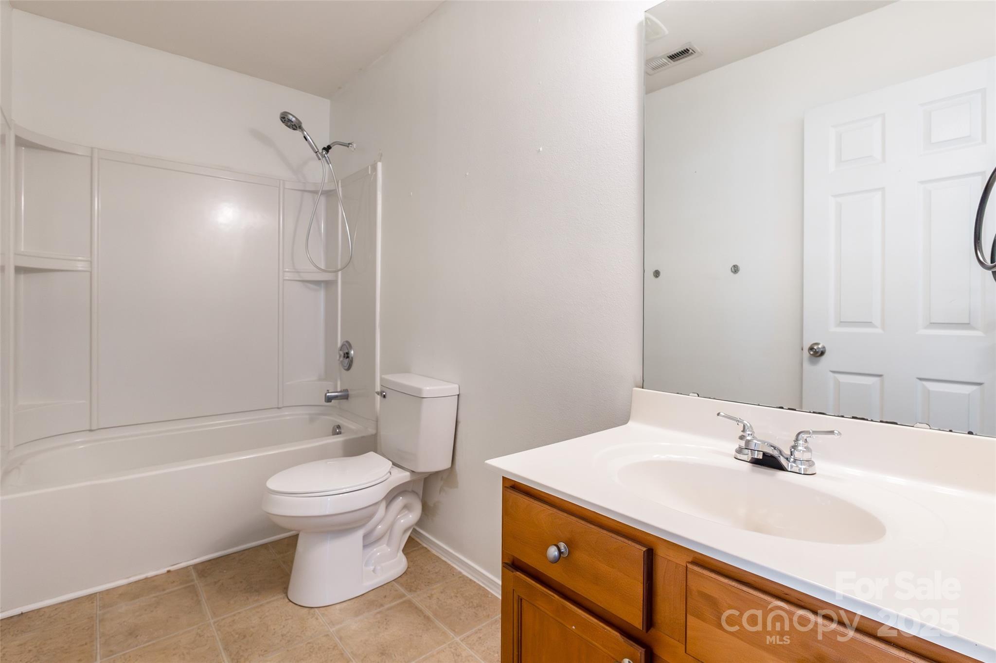 2357 Riding Trail Road Gastonia, NC 28054 - Photo 26 of 32 a bathroom with a sink toilet and shower