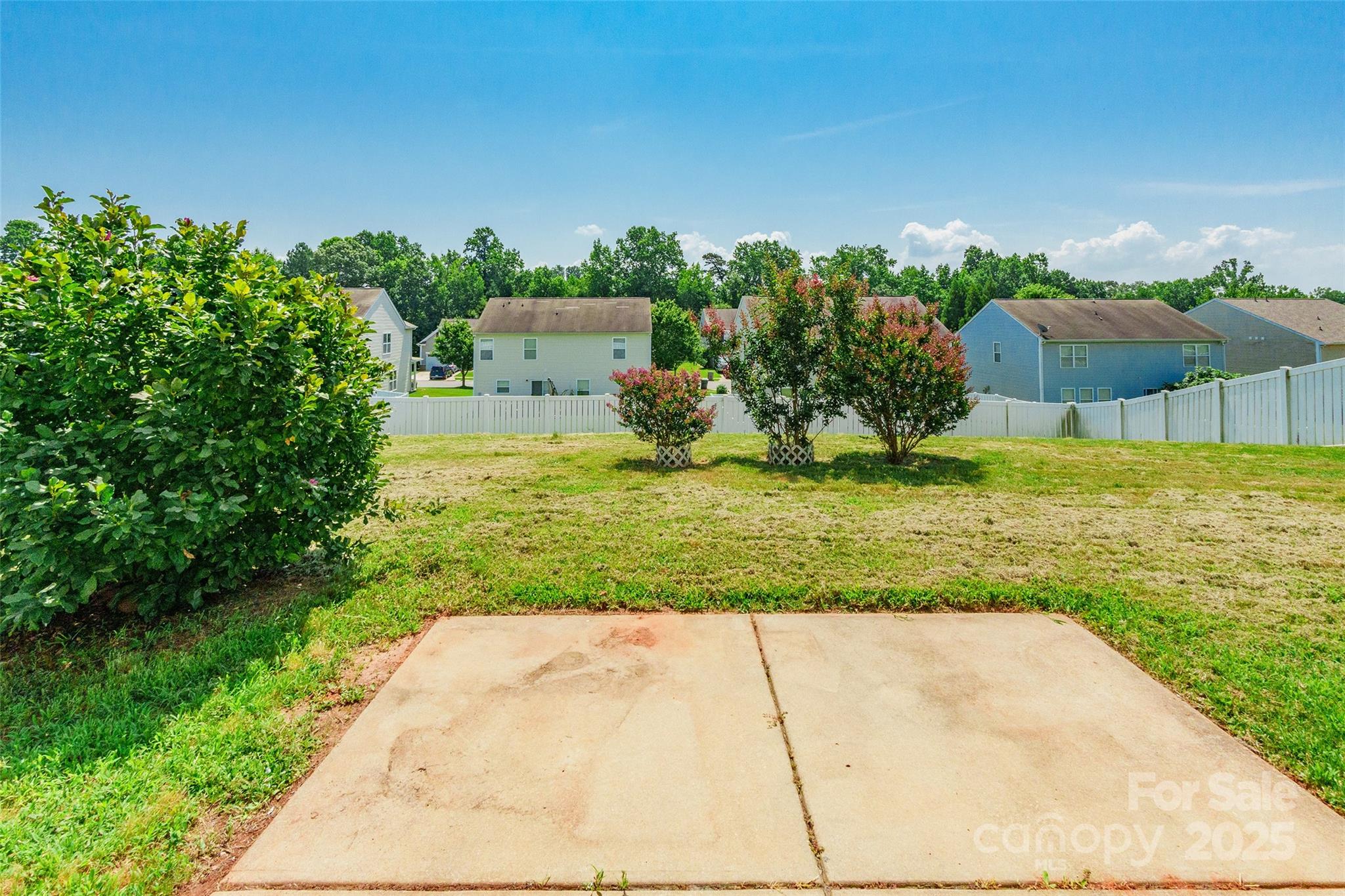 2357 Riding Trail Road Gastonia, NC 28054 - Photo 27 of 32 a view of a garden with a building in the background