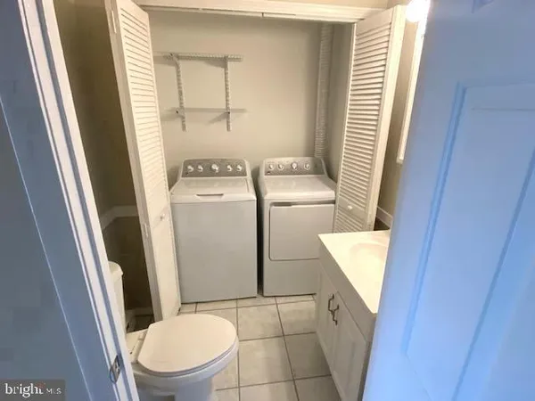 a bathroom with a toilet and a sink