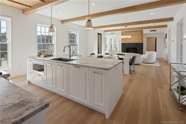 a spacious bathroom with a double vanity sink a mirror and a bathtub