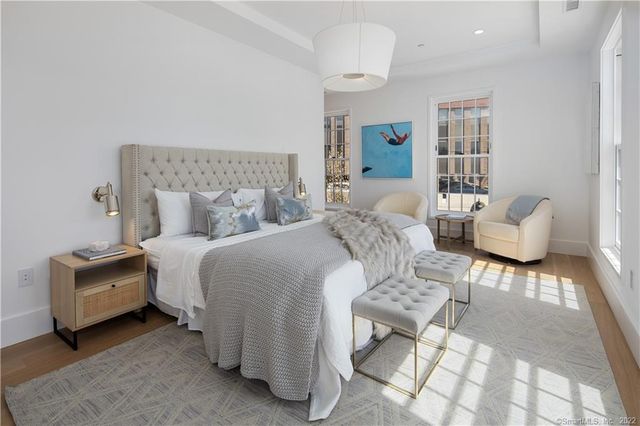 a bedroom with bed and a couch