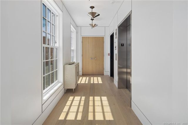 a view of a hallway with windows