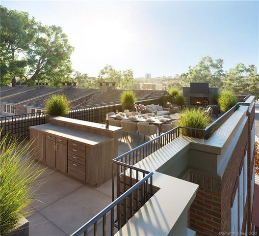 a view of city from terrace along with seating space