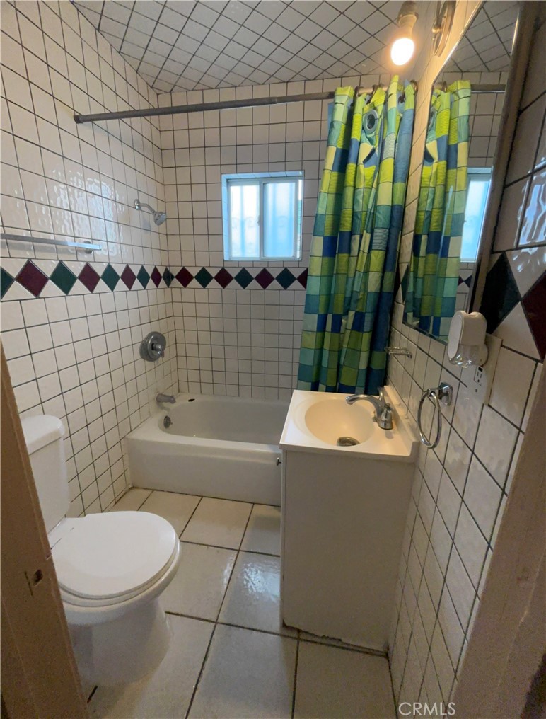3850 Dwight Avenue Riverside, CA 92507 - Photo 7 of 7 a bathroom with a sink a toilet and shower