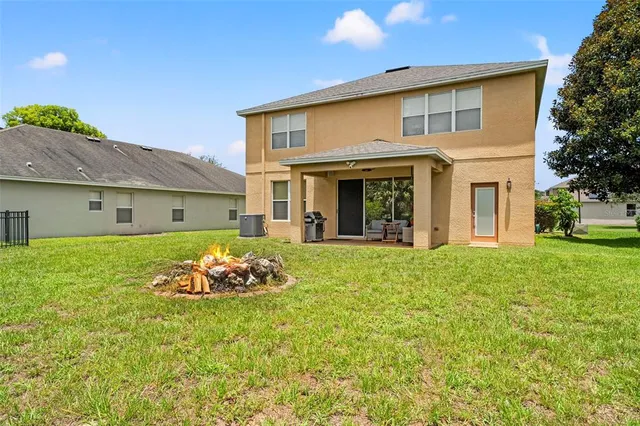 a view of a swimming pool with a yard