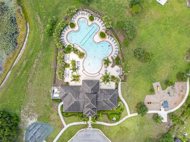 an aerial view of a house with garden space sitting space and swimming pool
