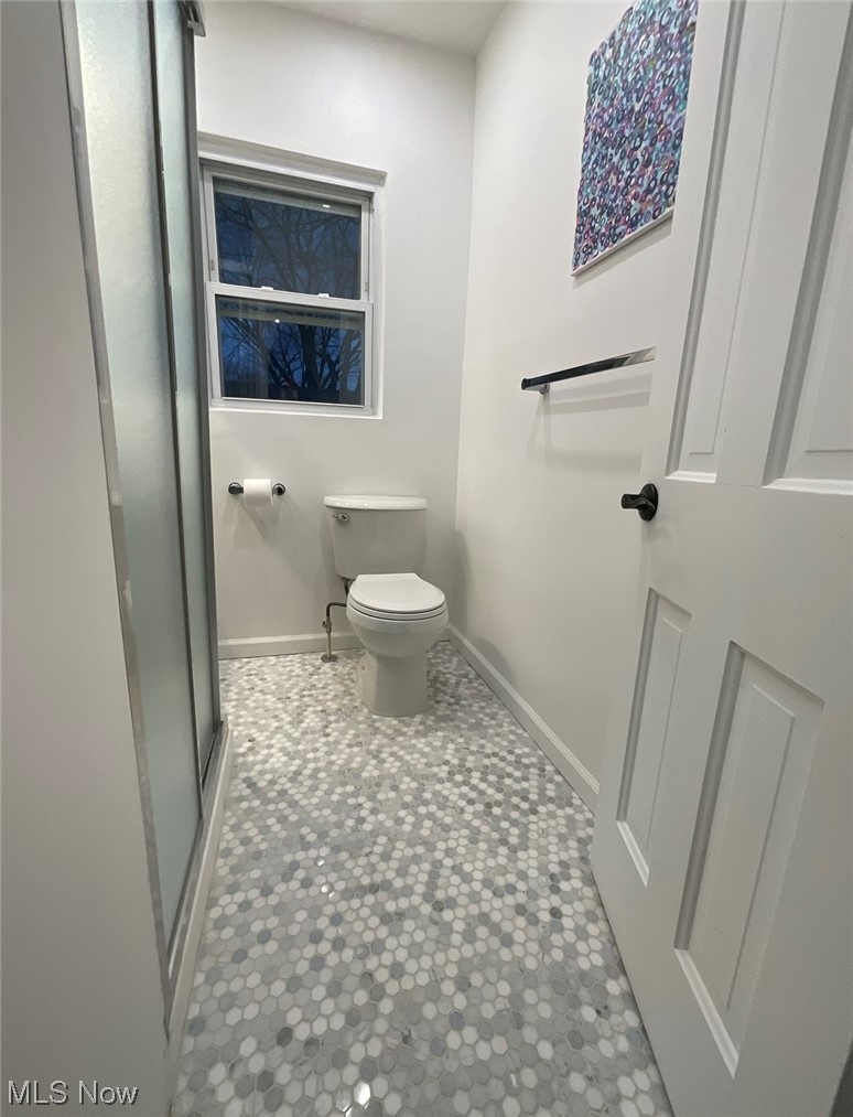 6303 Hillside Road Independence, OH 44131 - Photo 10 of 14 Bathroom with tile floors and toilet