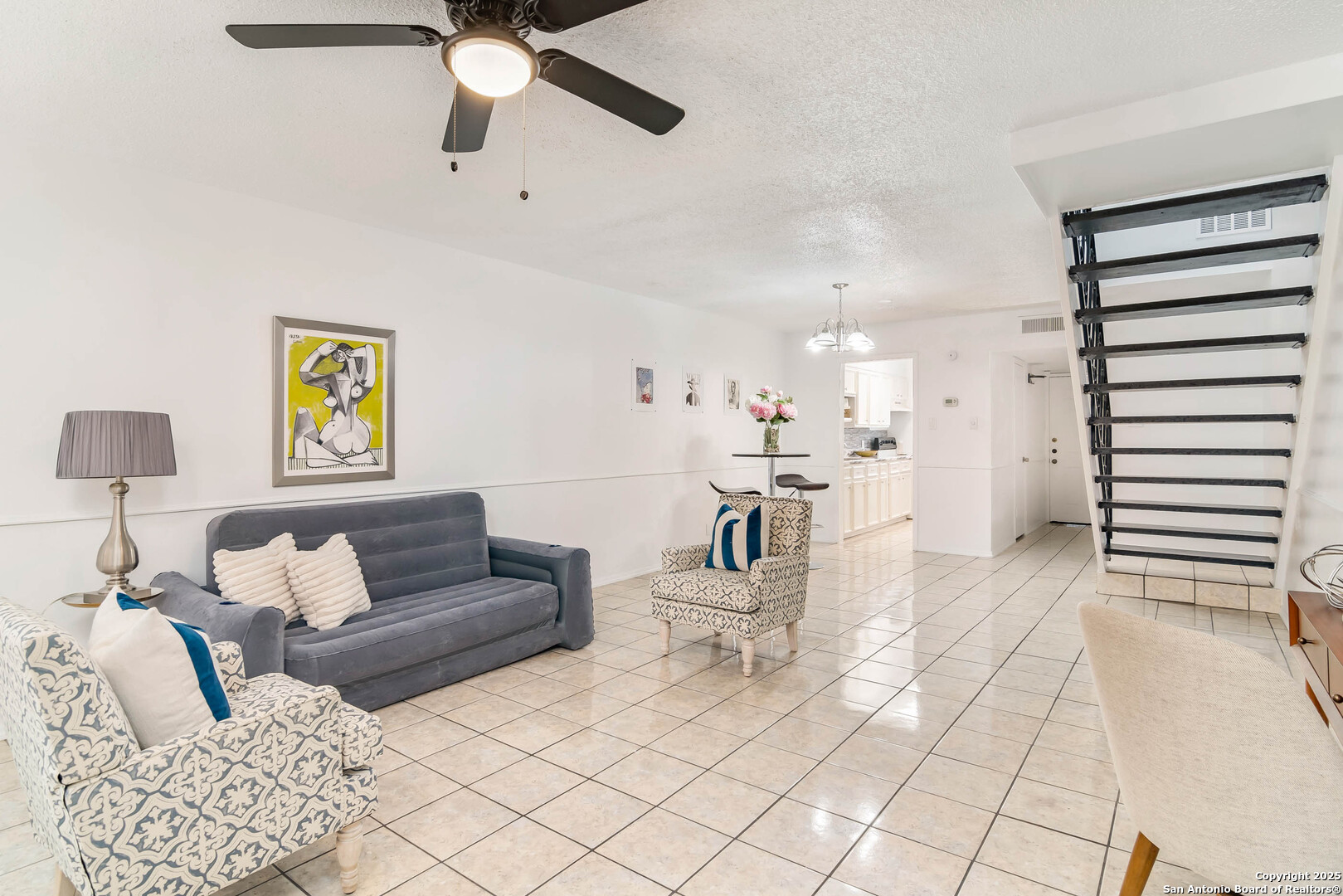 911 Vance Jackson Road, Unit A San Antonio, TX 78201 - Photo 11 of 20 a living room with furniture and a chandelier