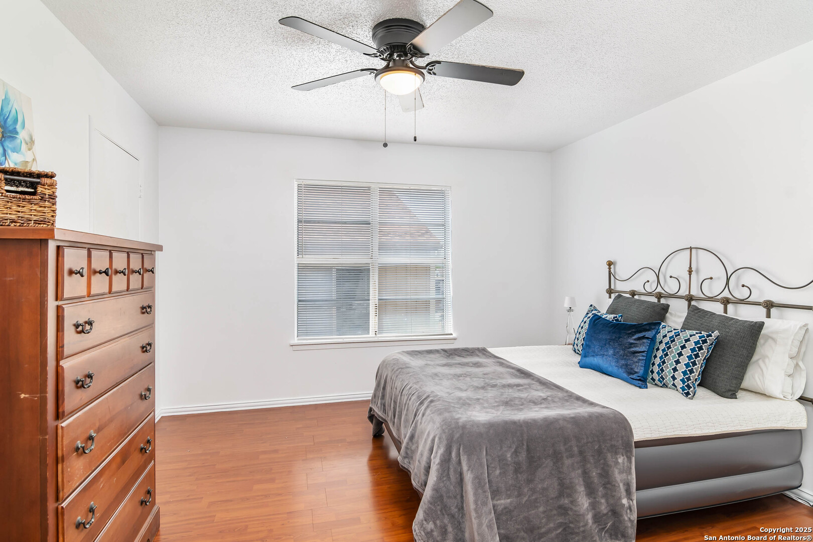 911 Vance Jackson Road, Unit A San Antonio, TX 78201 - Photo 15 of 20 a bedroom with a large bed and a window
