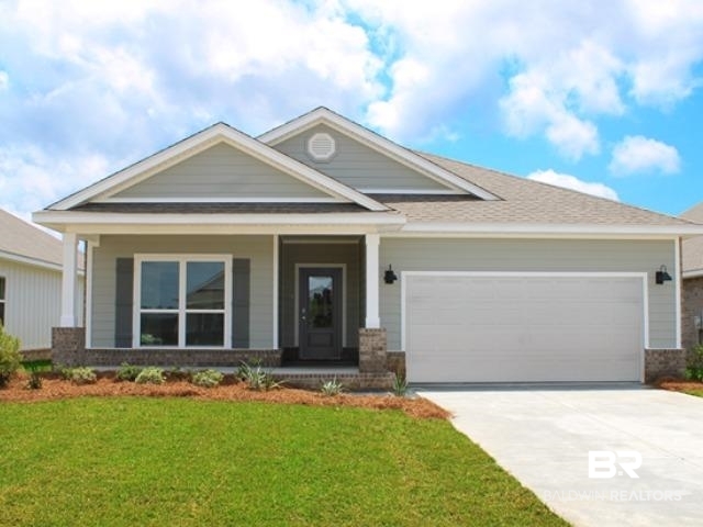 126 Millet Avenue Fairhope, AL 36532 - Photo 1 of 45 Craftsman-style house with covered porch, driveway, a garage, and brick siding