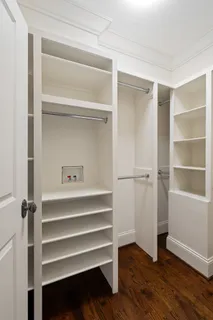 a bathroom with a tub a sink a mirror and a shower