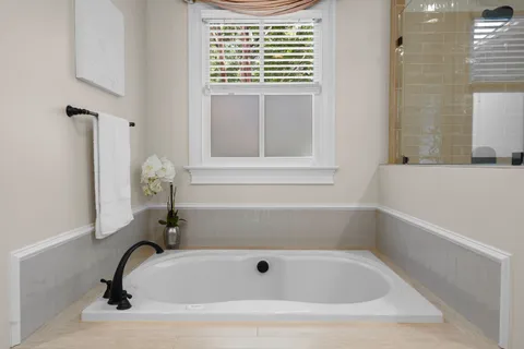 a living room with furniture a window and a fireplace