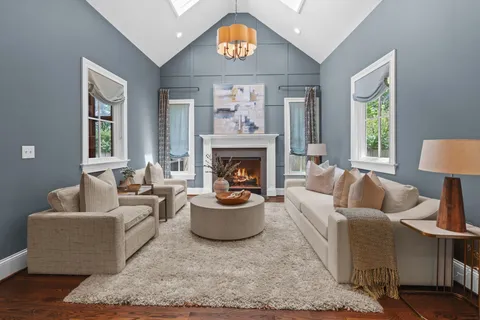 a view of a dining room with furniture wooden floor and chandelier