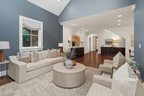 a kitchen with kitchen island granite countertop a sink a counter top space stainless steel appliances and cabinets