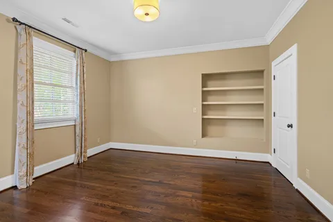 a bathroom with a granite countertop sink a toilet and a mirror