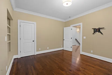 a bathroom with a shower and a glass door