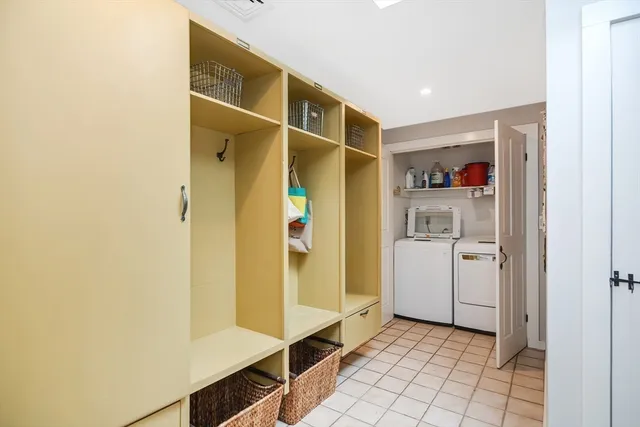 a view of walk in closet with white walls