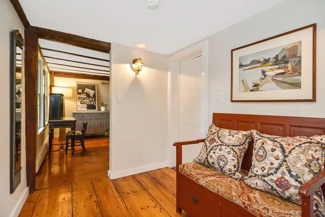 a view of a livingroom with furniture and hardwood floor