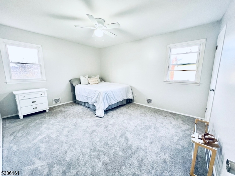 341 Trotting Road Union, NJ 07083 - Photo 23 of 24 a spacious bedroom with a bed and a window