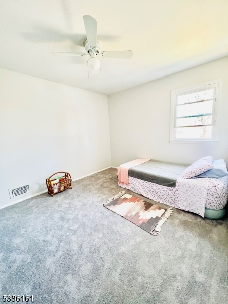 341 Trotting Road Union, NJ 07083 - Photo 24 of 24 a spacious bedroom with a bed and a window