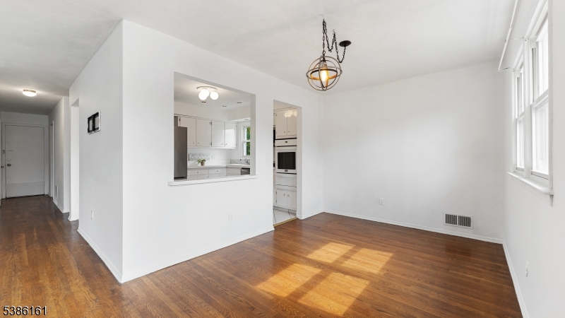 341 Trotting Road Union, NJ 07083 - Photo 3 of 24 a view of a room with wooden floor and hallway