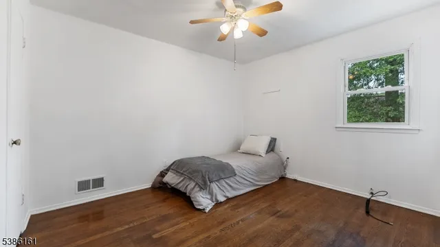 a room with a bed and a window