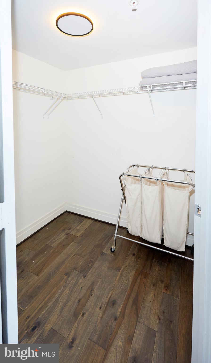414 Water Street, Unit 2601 Baltimore, MD 21202 - Photo 32 of 51 a view of a room with wooden floor