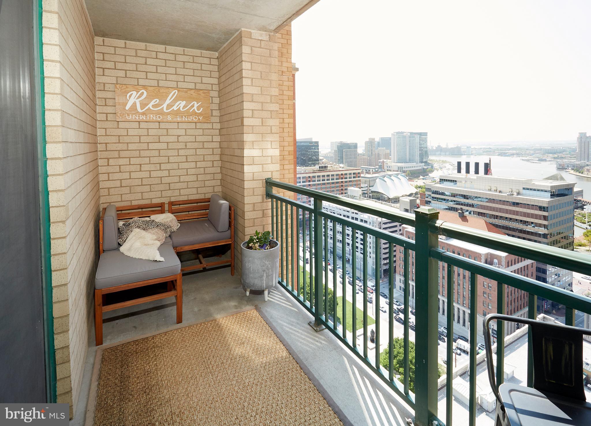 414 Water Street, Unit 2601 Baltimore, MD 21202 - Photo 37 of 51 a balcony with a couch