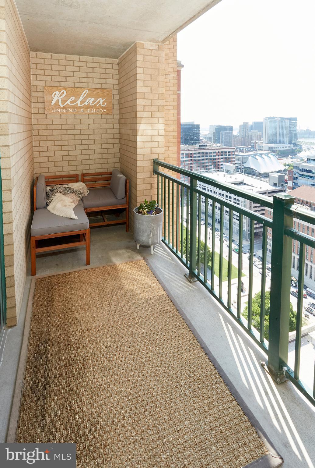 414 Water Street, Unit 2601 Baltimore, MD 21202 - Photo 38 of 51 a balcony with furniture and city view