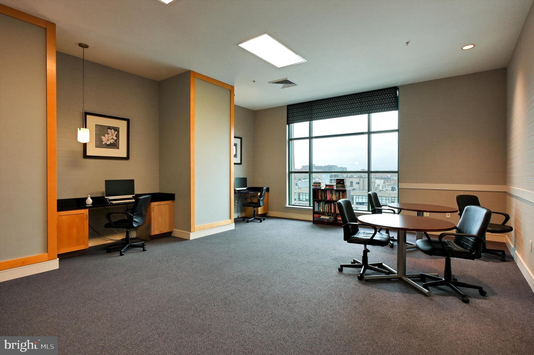 414 Water Street, Unit 2601 Baltimore, MD 21202 - Photo 47 of 51 a view of a livingroom with workspace and a window