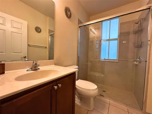 an empty room with a empty space and windows