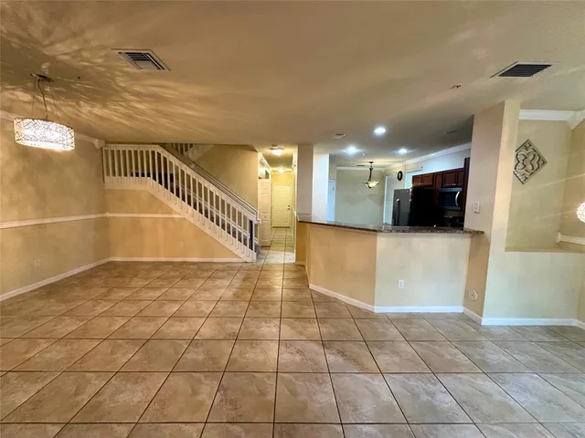 front view of a house with a potted plant