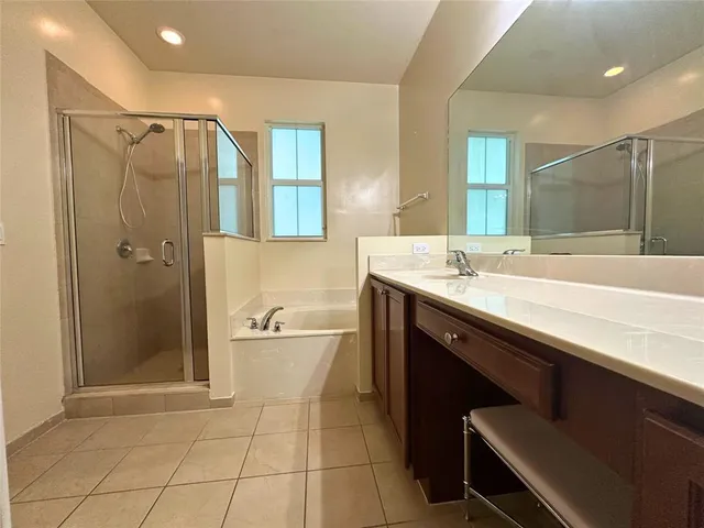 a bathroom with a glass shower door
