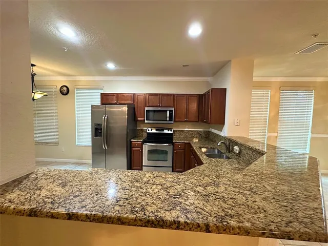 a view of a garden with large trees