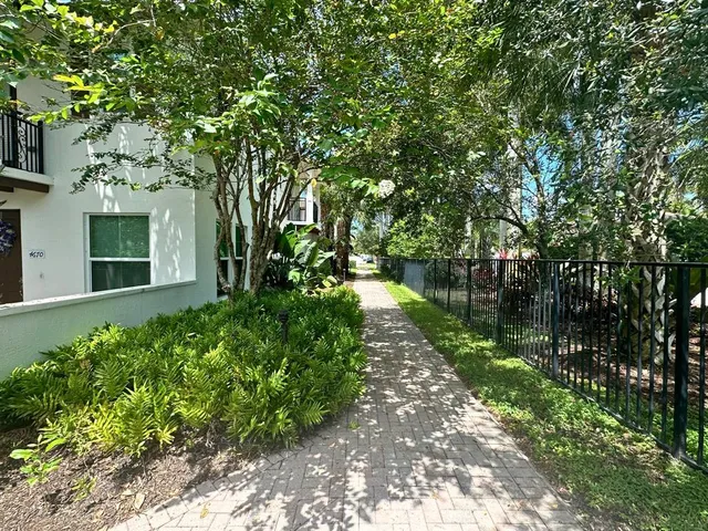 a kitchen with stainless steel appliances granite countertop a sink refrigerator and microwave