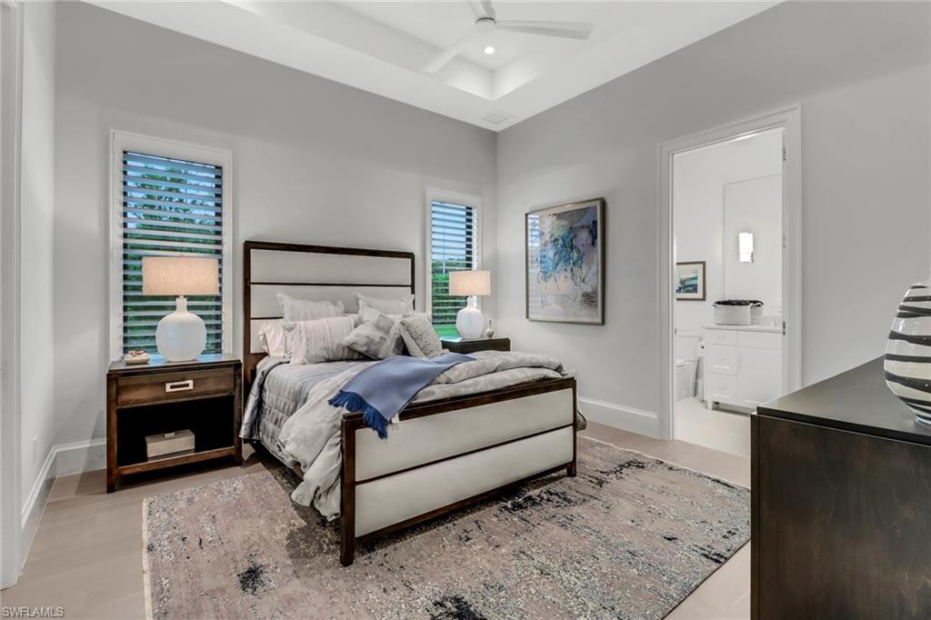 12 Banyan Road Naples, FL 34108 - Photo 26 of 44 a bed room with a bed and a night stand