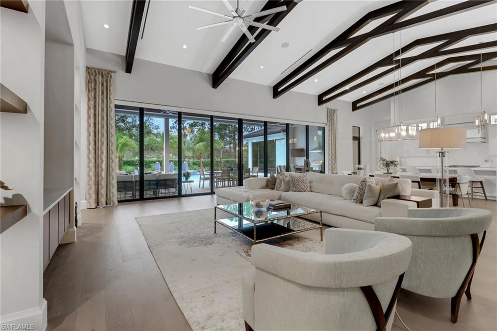 12 Banyan Road Naples, FL 34108 - Photo 7 of 44 a living room with furniture and a large window