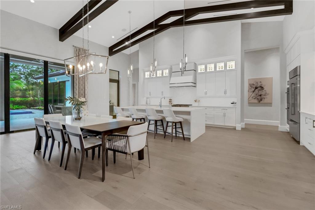 12 Banyan Road Naples, FL 34108 - Photo 10 of 44 a dining room with furniture and window