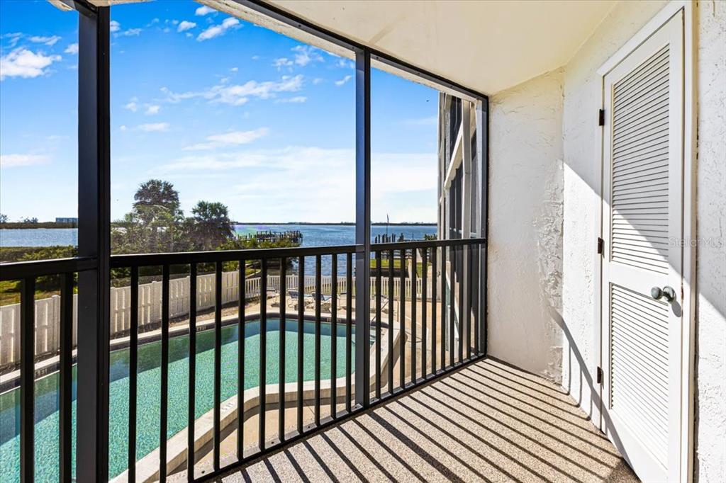 53 West Bay Heights Road, Unit 205 Englewood, FL 34223 - Photo 11 of 43 a view of a balcony with wooden floor