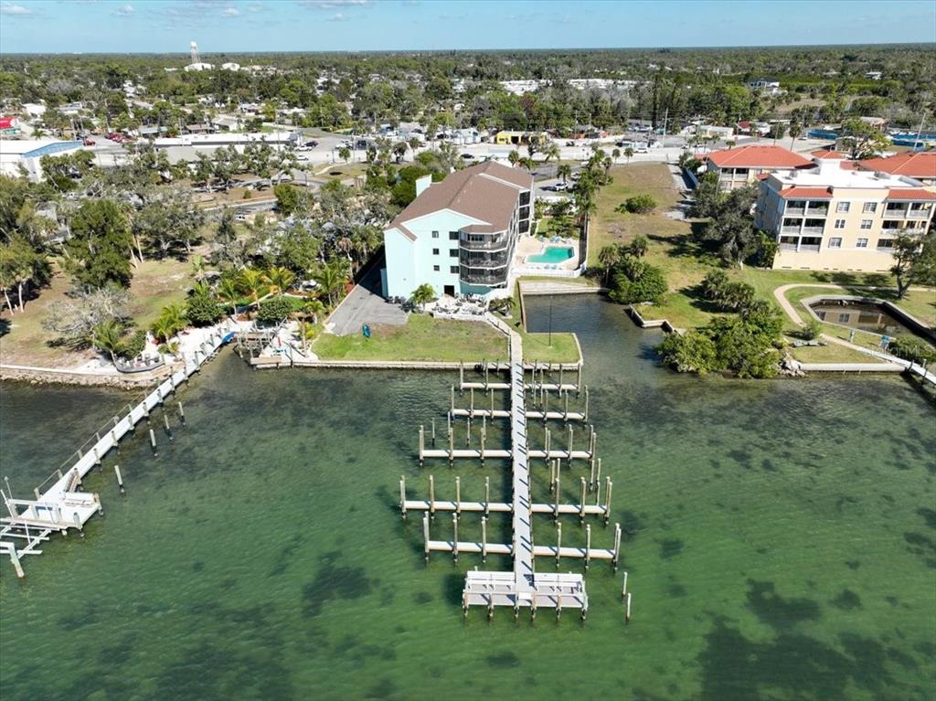 53 West Bay Heights Road, Unit 205 Englewood, FL 34223 - Photo 15 of 43 an aerial view of residential houses with outdoor space