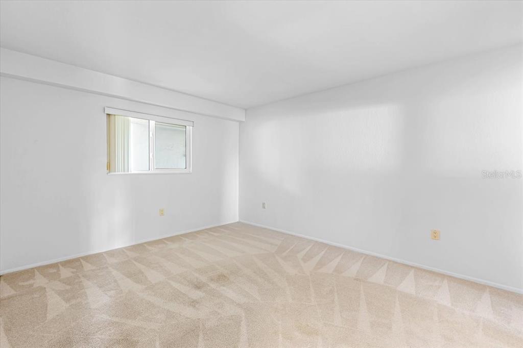 53 West Bay Heights Road, Unit 205 Englewood, FL 34223 - Photo 26 of 43 a view of an empty room with a window