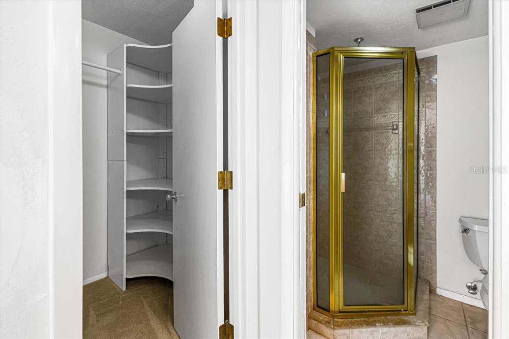 53 West Bay Heights Road, Unit 205 Englewood, FL 34223 - Photo 35 of 43 a view of walk in closet with empty racks